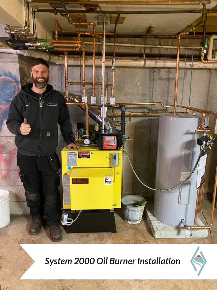 Corey Cavicchi with customer's System 2000 oil burner after installation